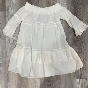 Either a cover up or an off the shoulder dress